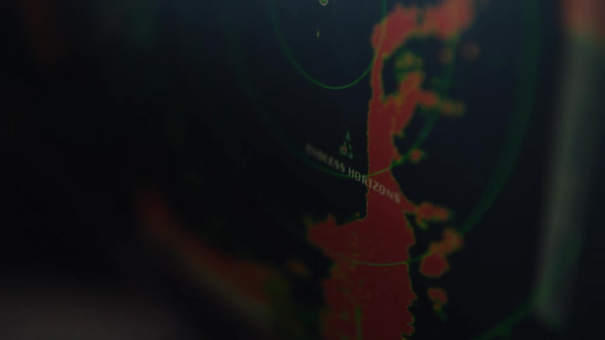 Radar screen displays nautical map with red and green markings