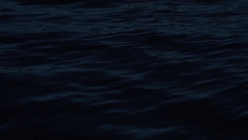 Dark sea surface with small visible ripples