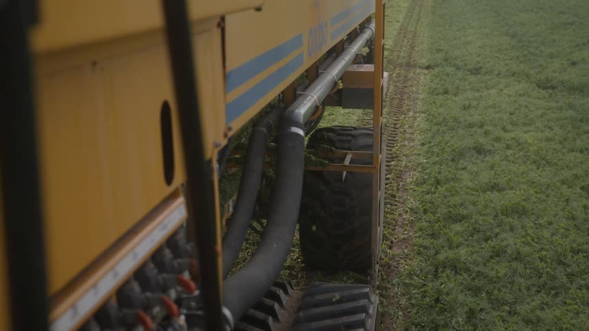 The vehicle is seeding the grass