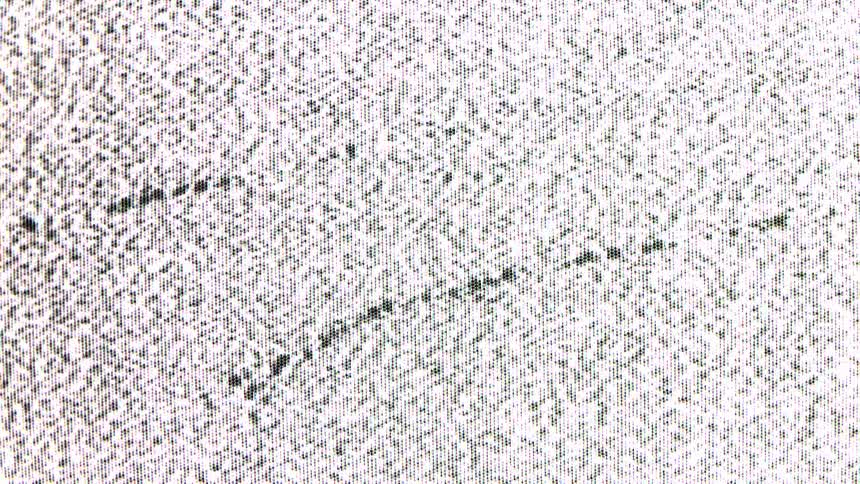 Screen shows black and white static noise in a grainy pattern