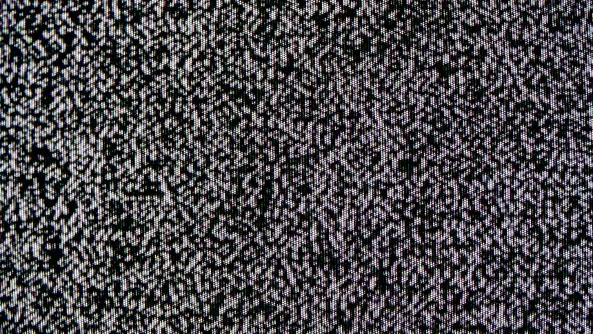Screen displays a dense pattern of black and white static
