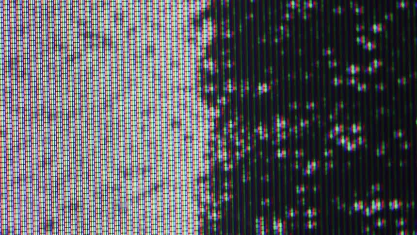 Closeup of screen pixels showing colorful pattern and static noise
