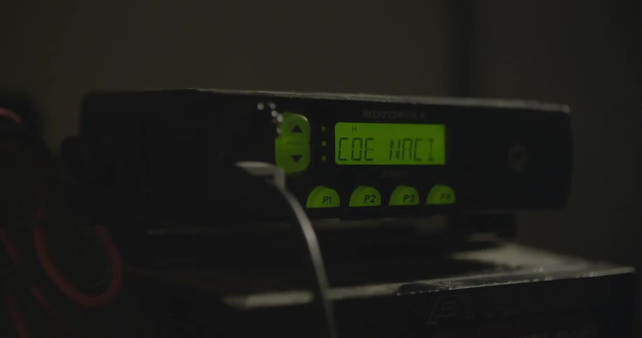A radio is lit with a green display