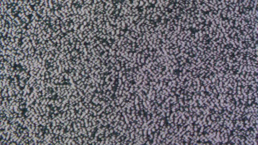 Closeup of black and white static noise on a screen
