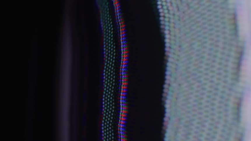 A television screen displays white noise and a distorted image