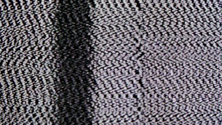 A screen has a vertical black line and a static pattern moving on it