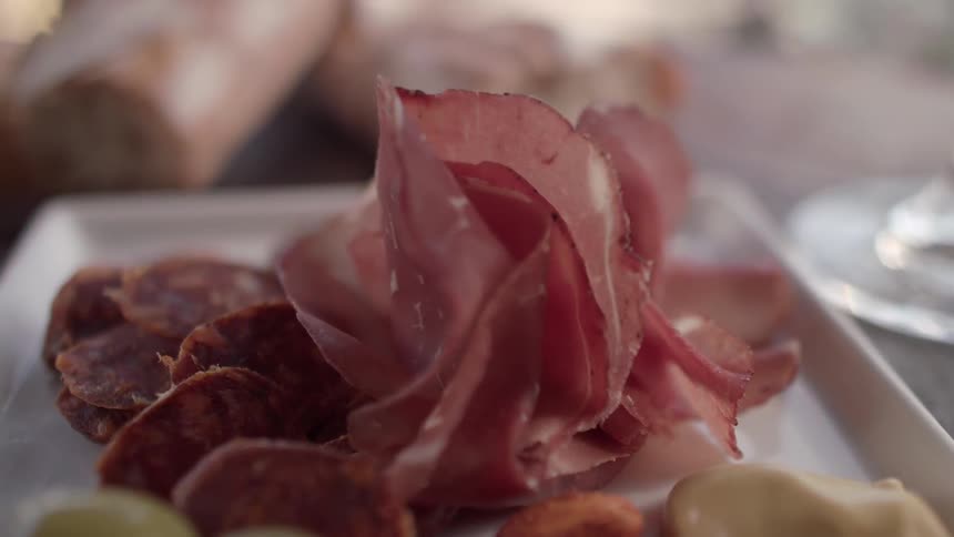 Meat is stacked on a plate