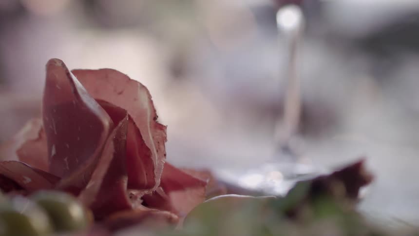 A plate with food is set on a table outside