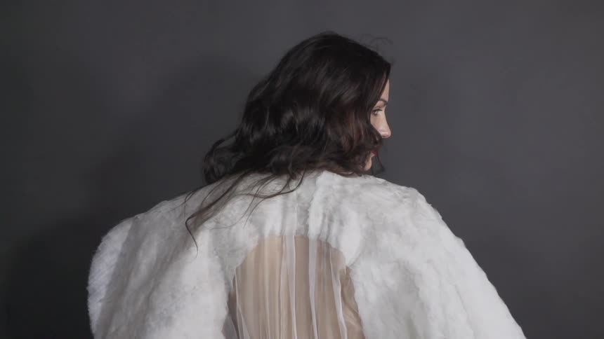 Woman slowly turning around