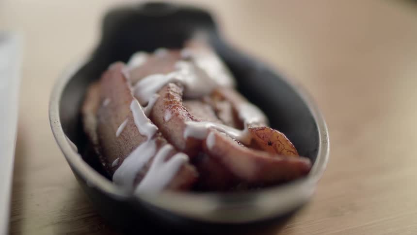 Food sits in a cast iron bowl