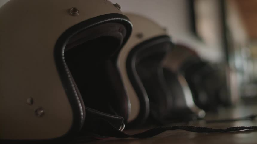 Helmets are lined up on a table