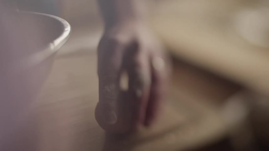 An egg is cracked on a kitchen counter