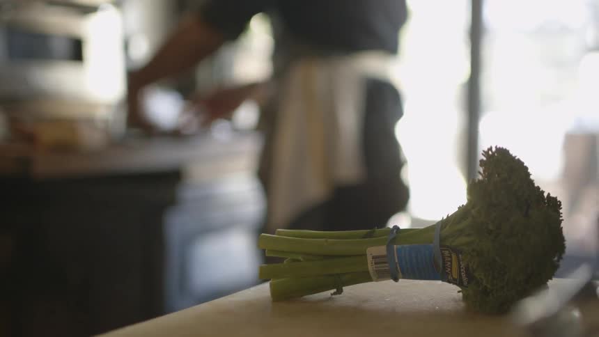A person cooks in the kitchen