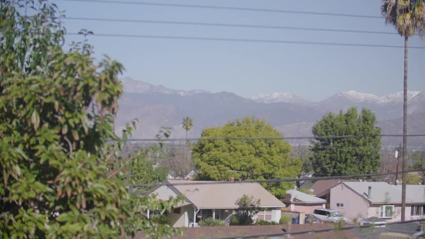 Mountains lay behind these houses