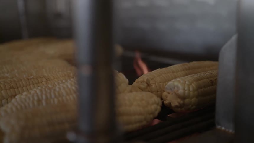 Corn is cooking on the grill