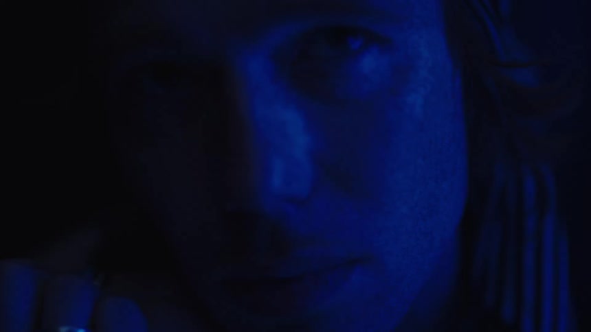 The man looks nervous in the dark