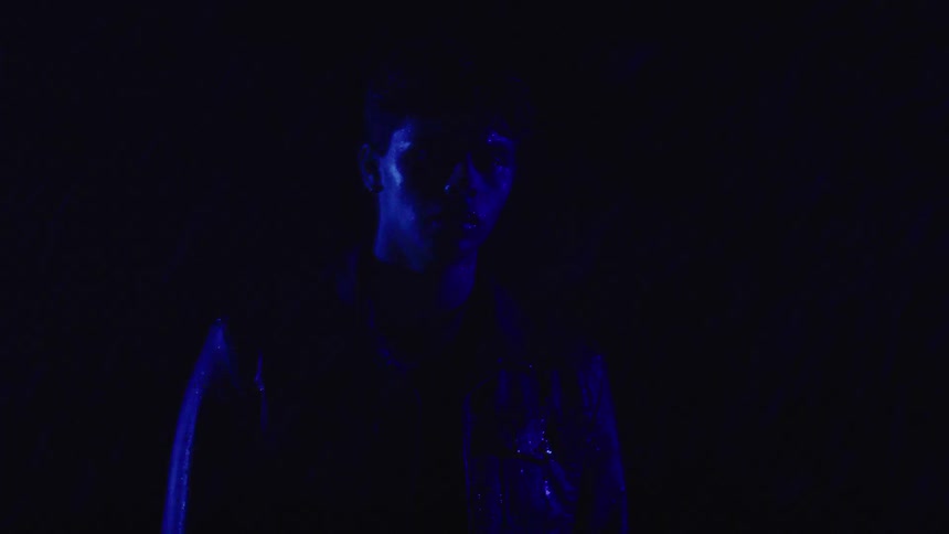 Rain is powering on the man in the dark