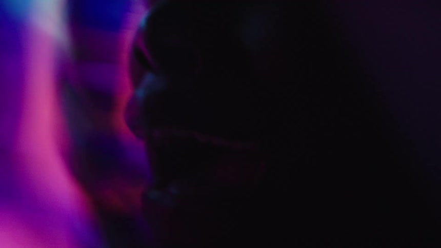 Arted lips in closeup illuminated by soft light