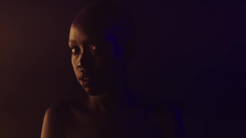 Young woman in a dark environment with low lighting