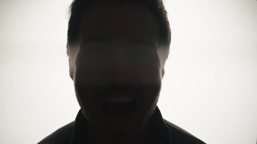 A man yells at the camera