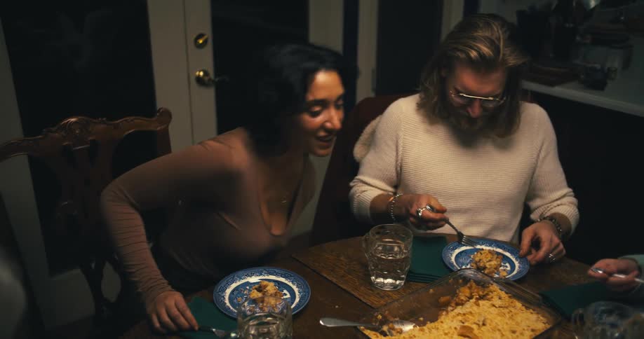 A family have dinner together at home