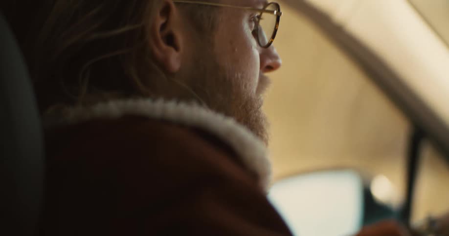 A blonde man driving