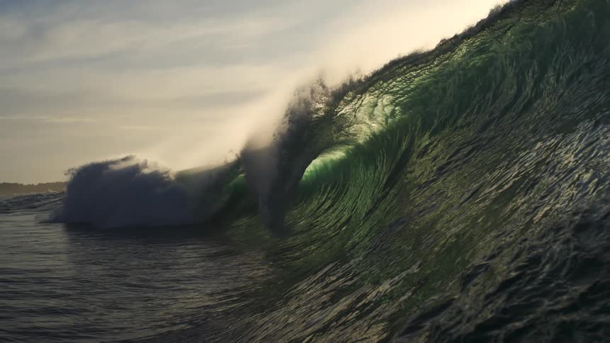 Large wave crashing in the ocean in slow motion