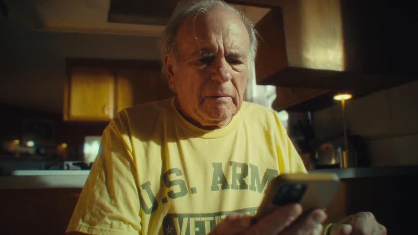 Man nodding and talking on his cell phone