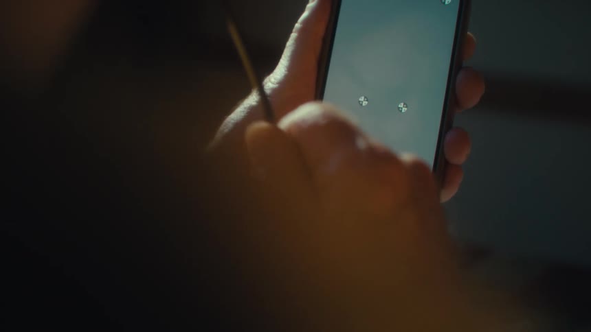 A person his looking at the display on their phone
