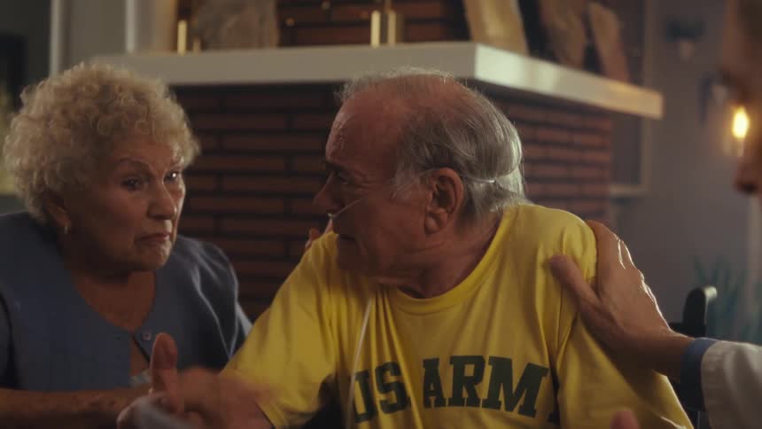 An elderly man gets emotional as a doctor shares medical report