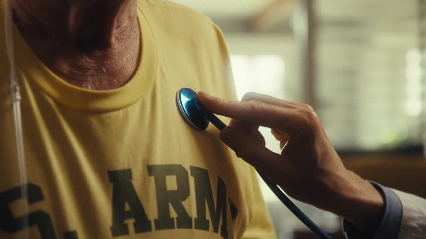 The doctor is checking a patient at home