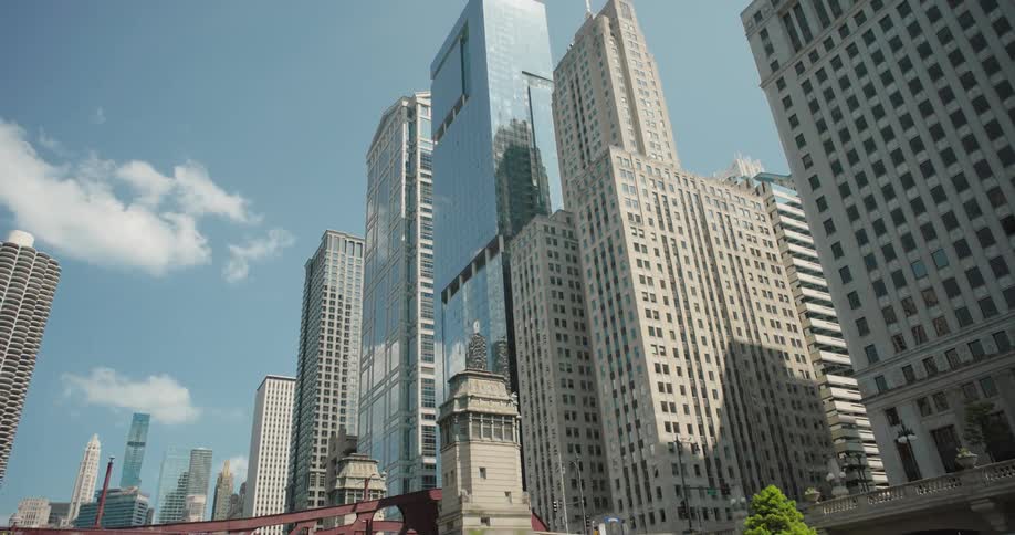 People walk by the water in the big city