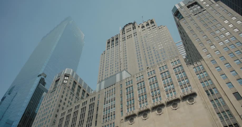 A cityscape of tall skyscrapers against the sky