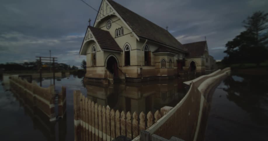 A church stands partially submerged in water after a flood