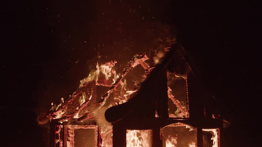 The home his burning down at night