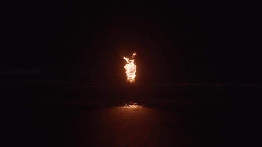 A mannequin is engulfed in flames