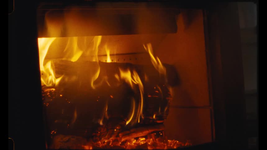 Wood is added to the fireplace