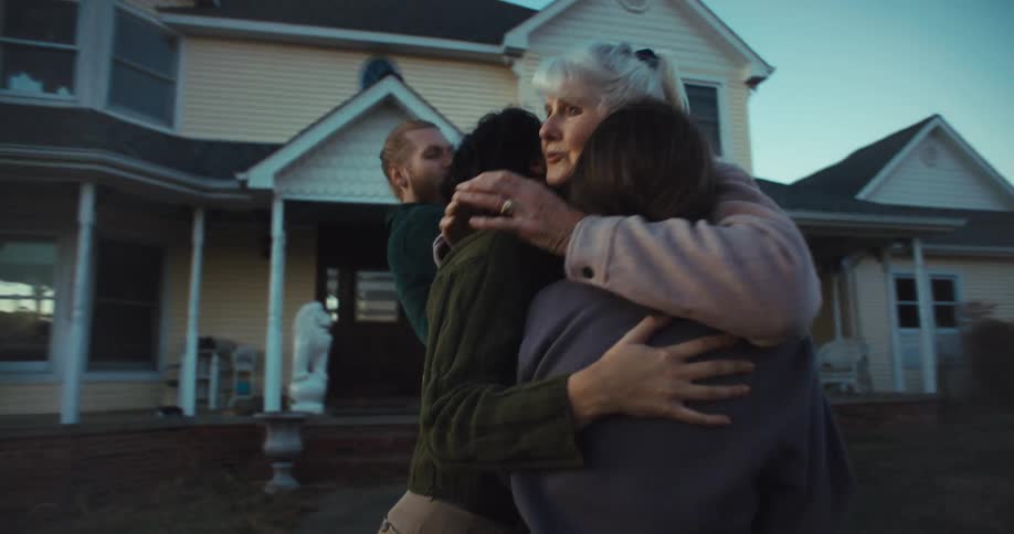 Family members embrace emotionally during a sendoff
