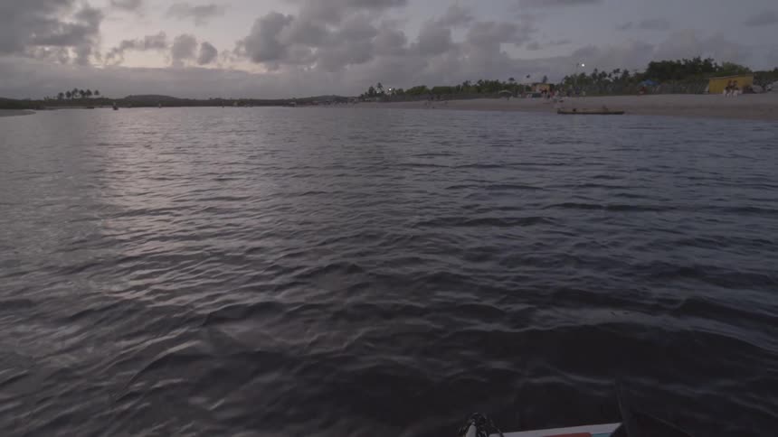 The boat is traveling towards the beach