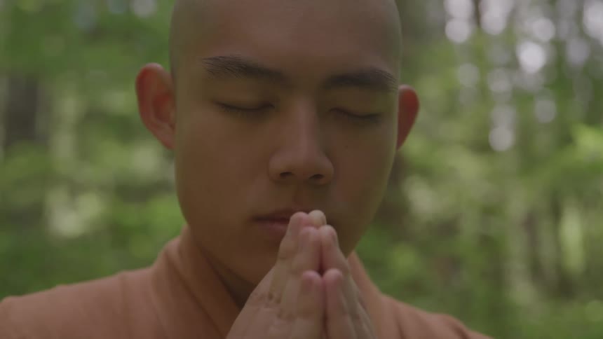 The monk is praying by the forest