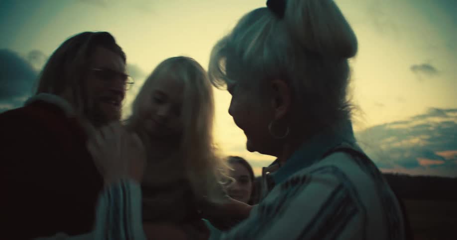 A family greet each other at sunrise