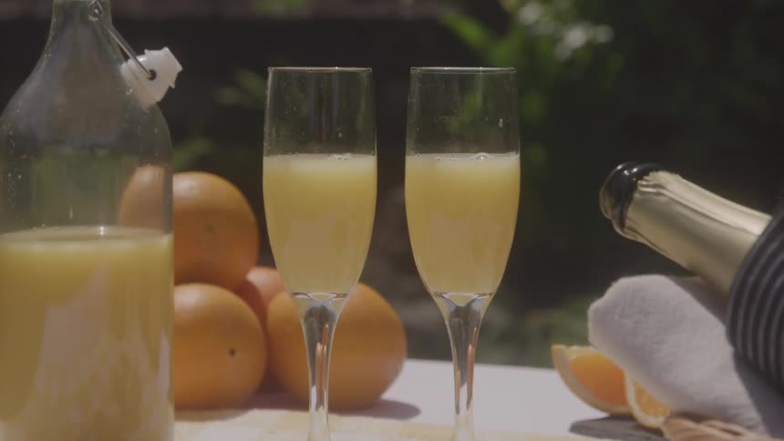 Two glasses of orange juice cocktails on the table