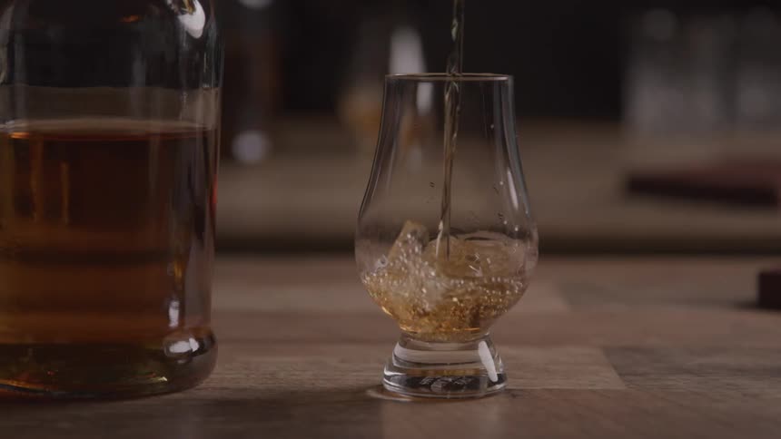 Alcohol is poured into a glass
