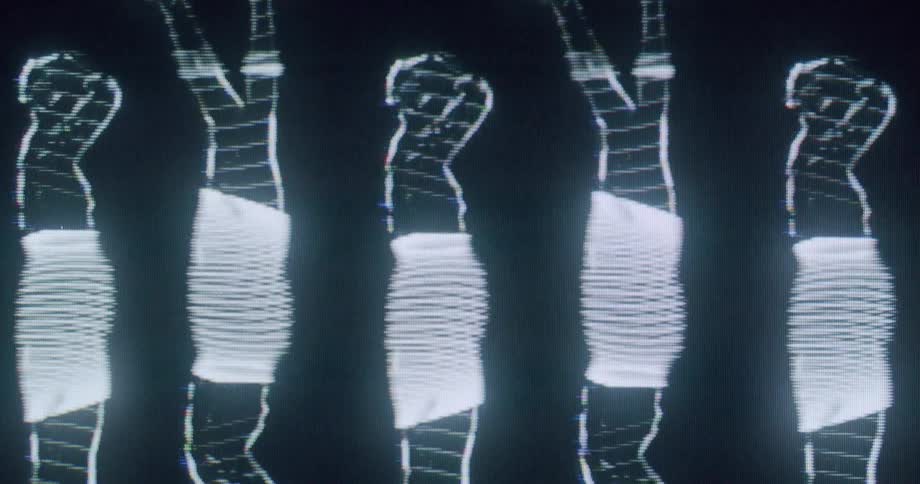 A figure of a woman is displayed on a screen and modified with digital effects
