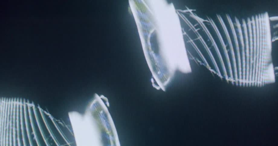 Distorted digital silhouettes appear in a repetitive luminous pattern