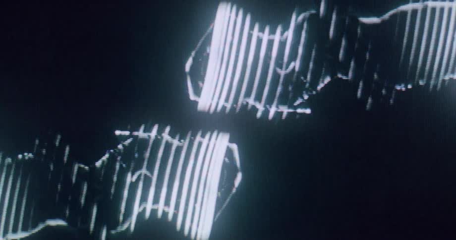 Luminous projections of human figures on a dark background