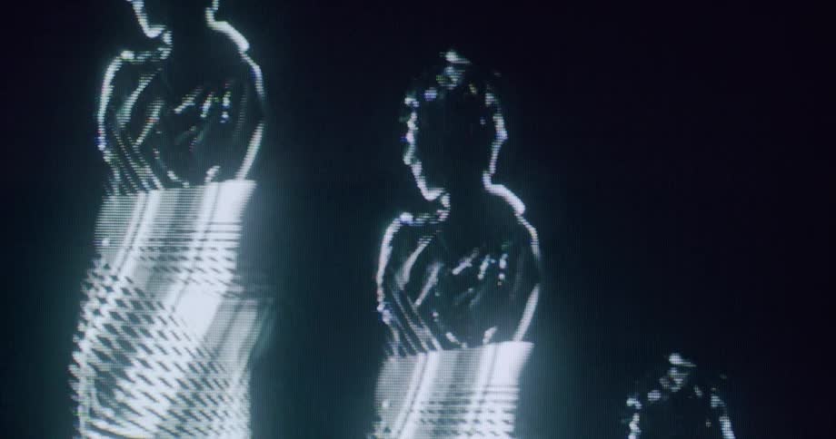Women dance together on the hologram