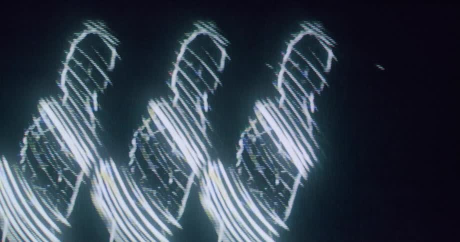 Three icons of a woman are dancing in the hologram