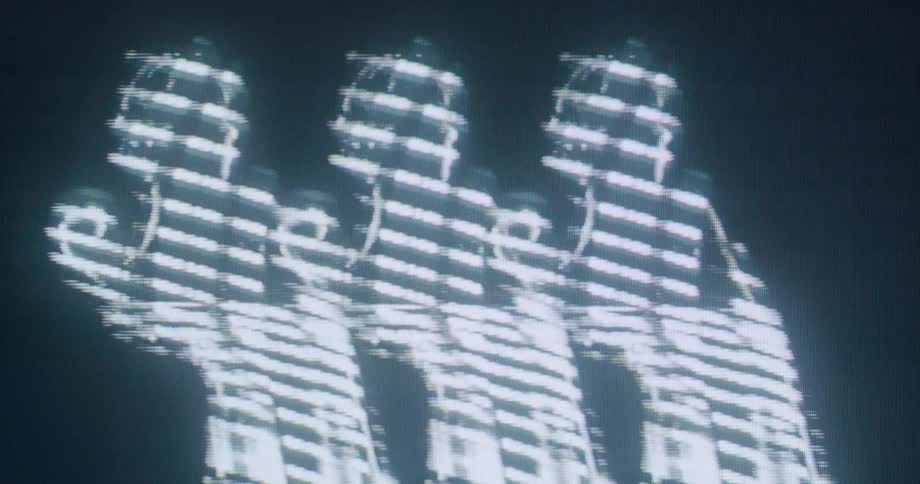 The hologram is of a repeated woman dancing and waving her arms