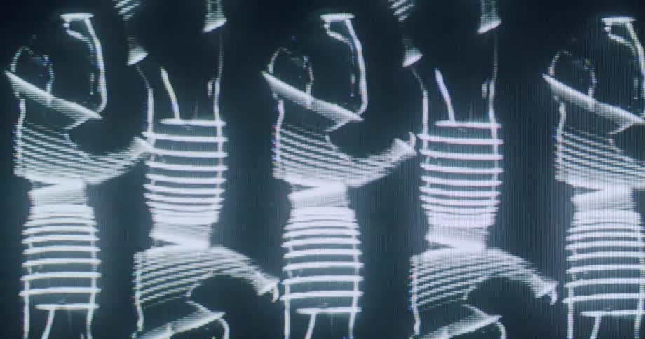 The video shows an artistic animation of abstract white digital lines that form and reform into patterns against a dark background the patterns shift from an almost humanlike silhouette to a more chaotic futuristic design